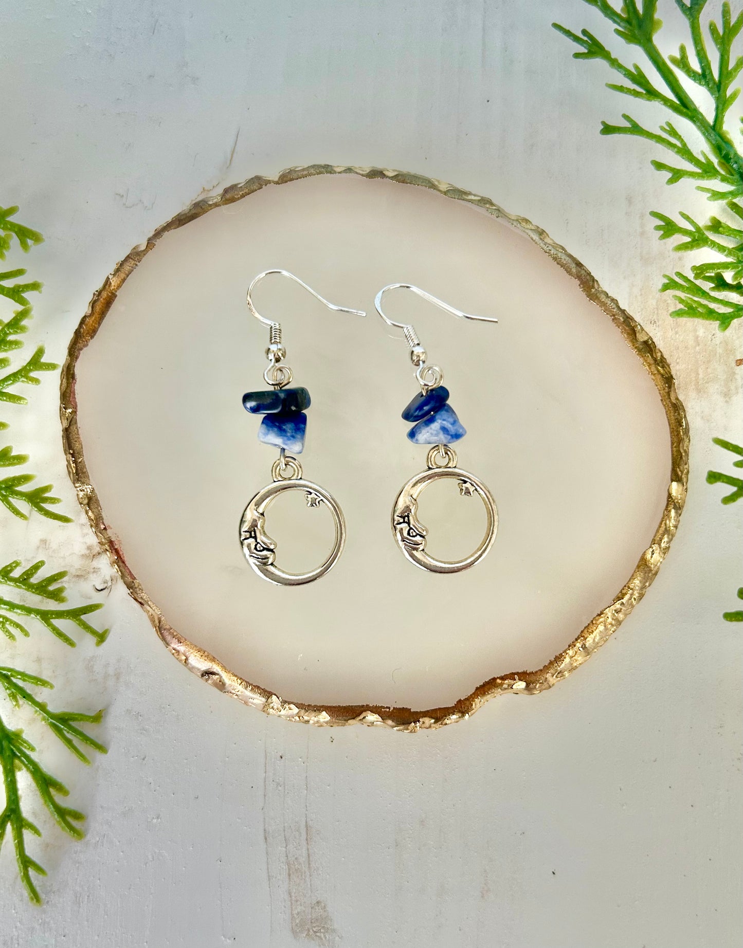 Hollow moon dangle earrings w/ blue crystals