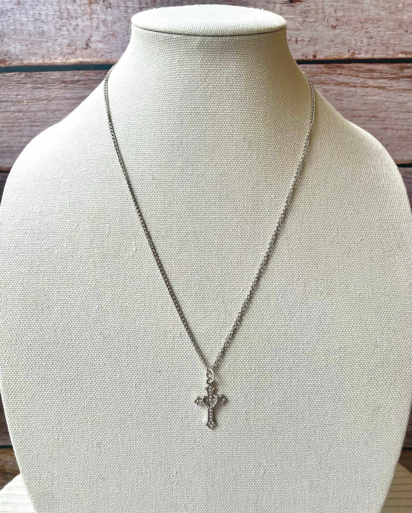 Heart wrapped cross necklace