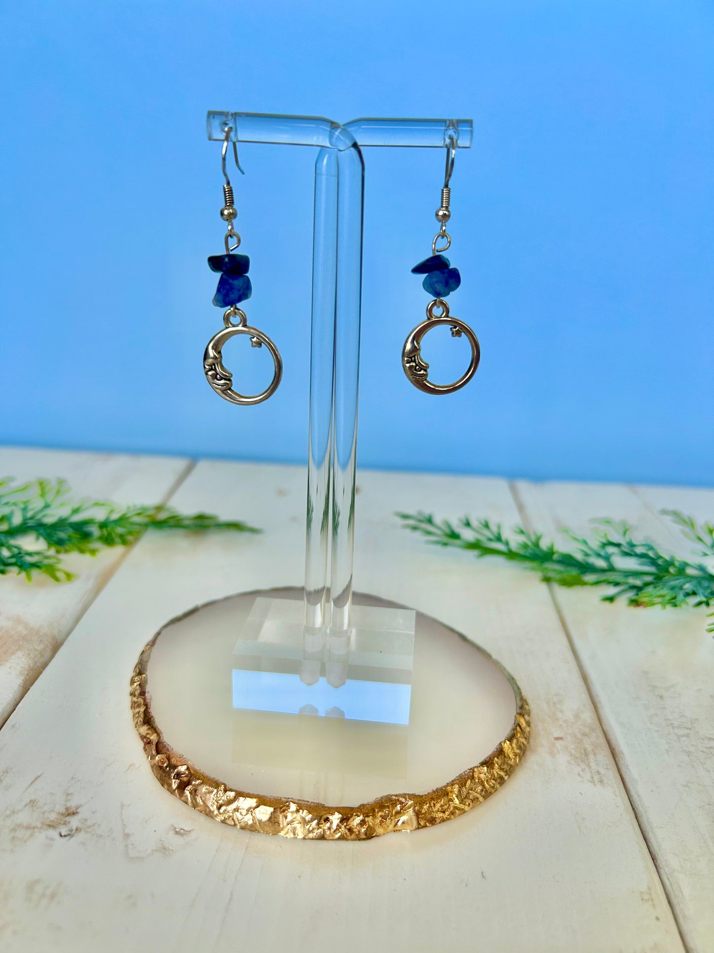 Hollow moon dangle earrings w/ blue crystals